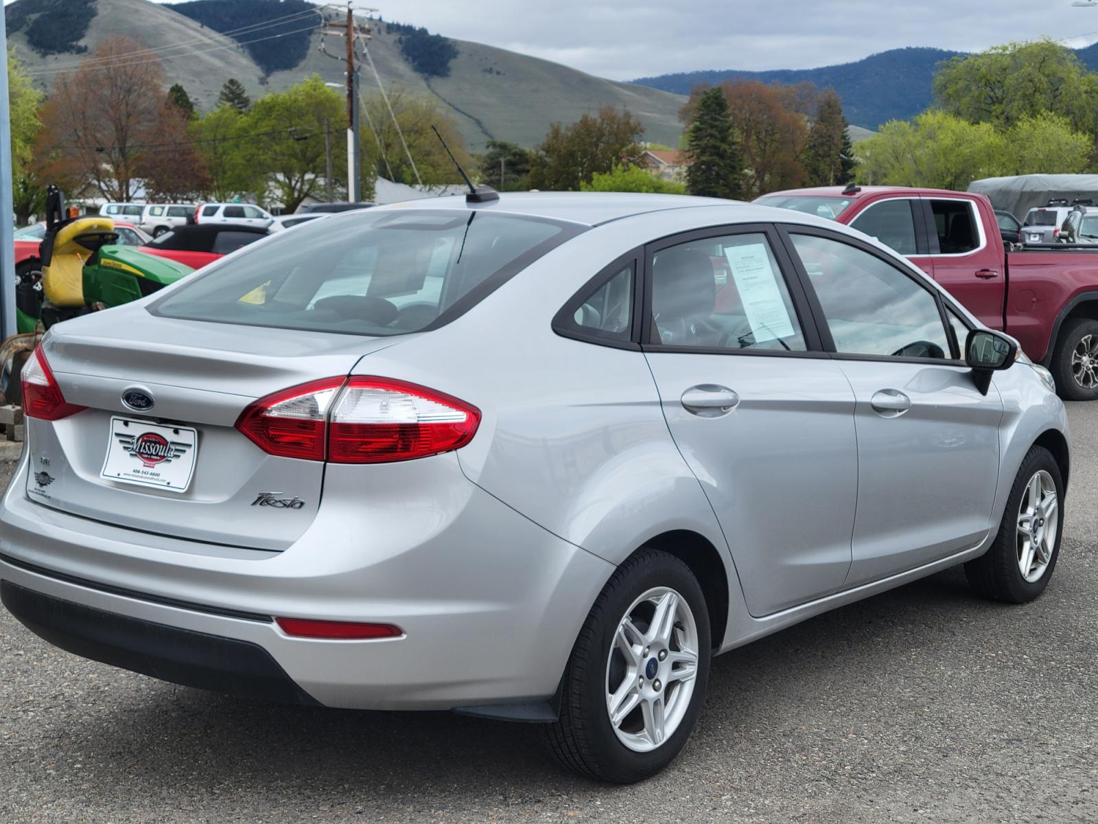 2019 Silver Ford Fiesta SE Sedan (3FADP4BJ2KM) with an 1.6L L4 DOHC 16V engine, Automatic transmission, located at 450 N Russell, Missoula, MT, 59801, (406) 543-6600, 46.874496, -114.017433 - Photo #1